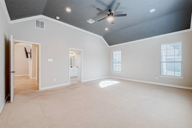 unfurnished bedroom featuring light carpet, multiple windows, ceiling fan, and crown molding