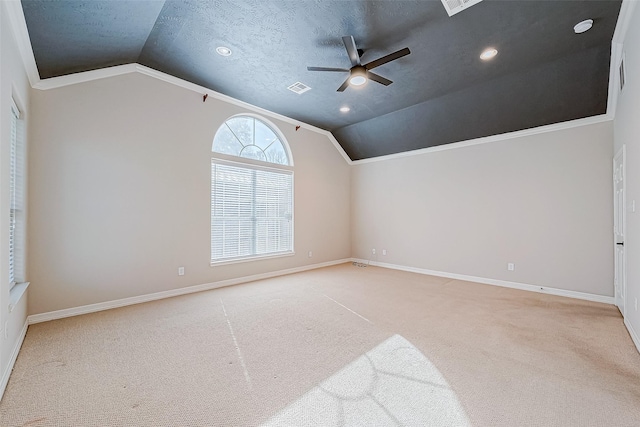 bonus room featuring ceiling fan, light colored carpet, lofted ceiling, and a textured ceiling