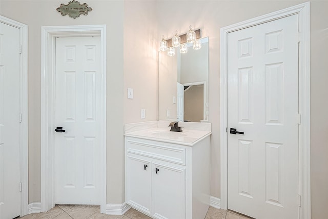 bathroom with tile patterned flooring and vanity