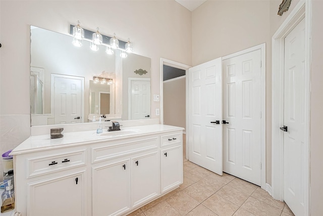 bathroom with tile patterned flooring and vanity