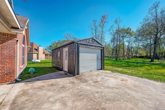 garage featuring a lawn