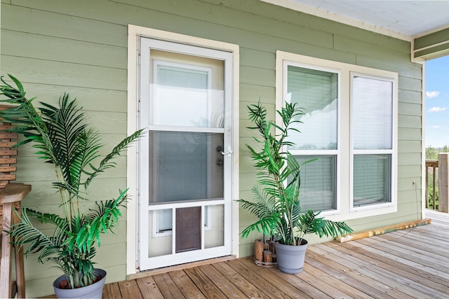 doorway to property featuring a wooden deck