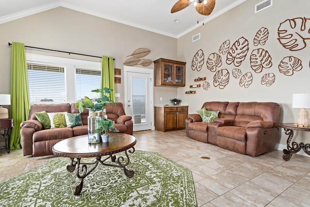 living room with lofted ceiling, crown molding, and ceiling fan