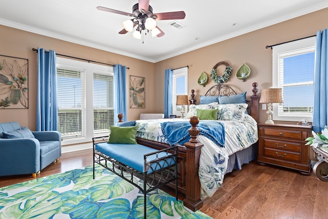 bedroom featuring crown molding, ceiling fan, and dark hardwood / wood-style flooring