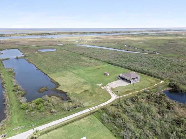 bird's eye view with a water view and a rural view