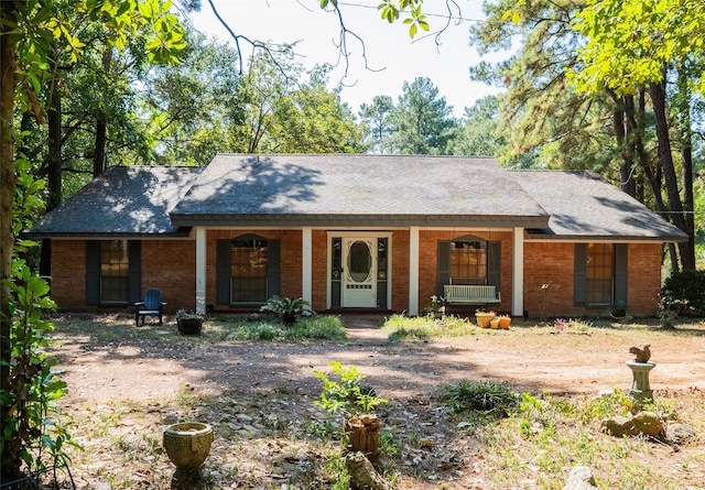 ranch-style house with covered porch