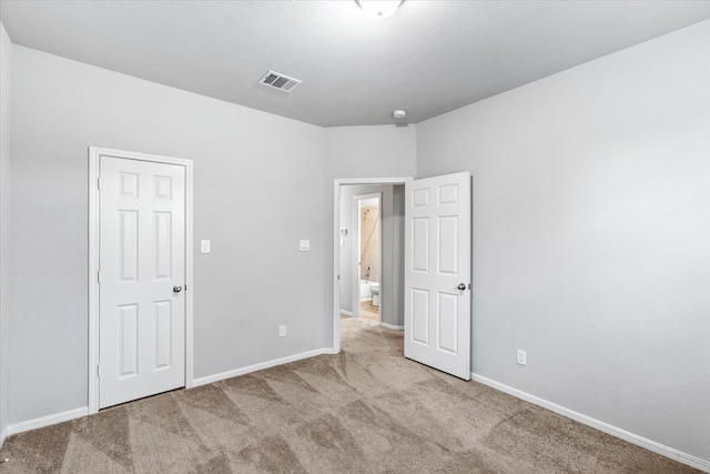 unfurnished bedroom featuring light colored carpet