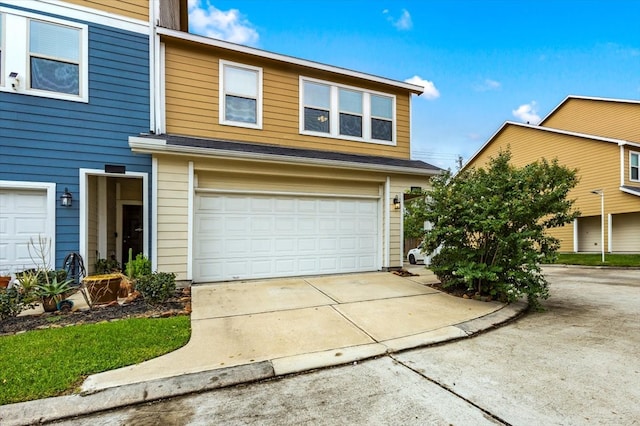 front of property with a garage