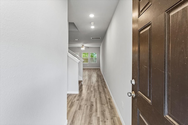 hall with light wood-type flooring