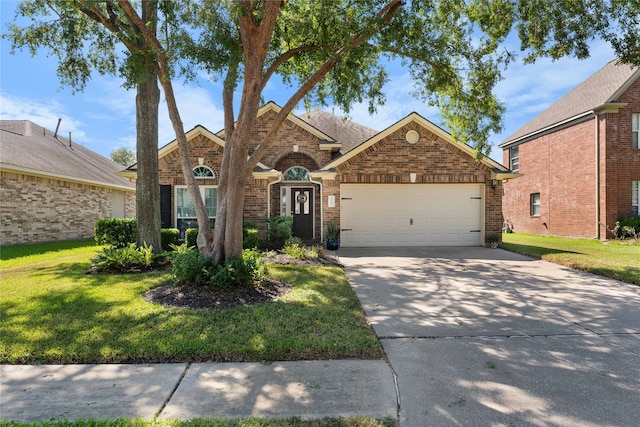 view of front facade with a garage and a front yard