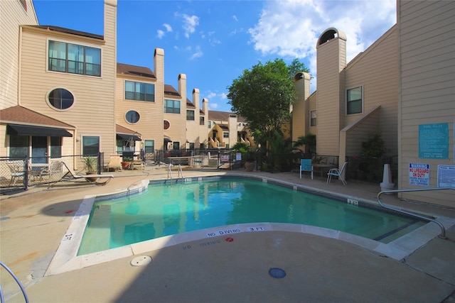 view of swimming pool with a patio