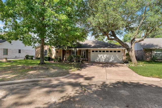 4415 Fallbrook Dr, Houston, TX 77018 - view of front facade featuring an attached garage, driveway, a front lawn, and brick siding