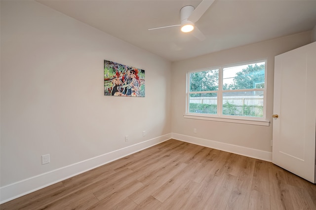 empty room with light hardwood / wood-style flooring and ceiling fan