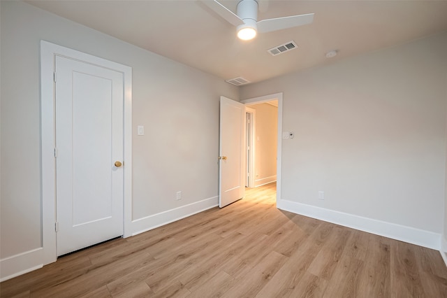 unfurnished bedroom featuring light wood-type flooring and ceiling fan