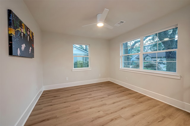 unfurnished room with hardwood / wood-style floors and ceiling fan