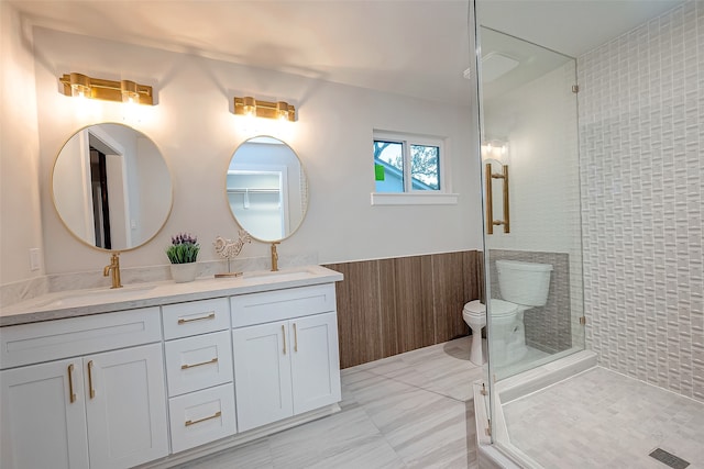 bathroom featuring vanity, toilet, wooden walls, and an enclosed shower