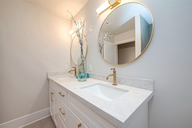 bathroom with vanity and tile patterned floors