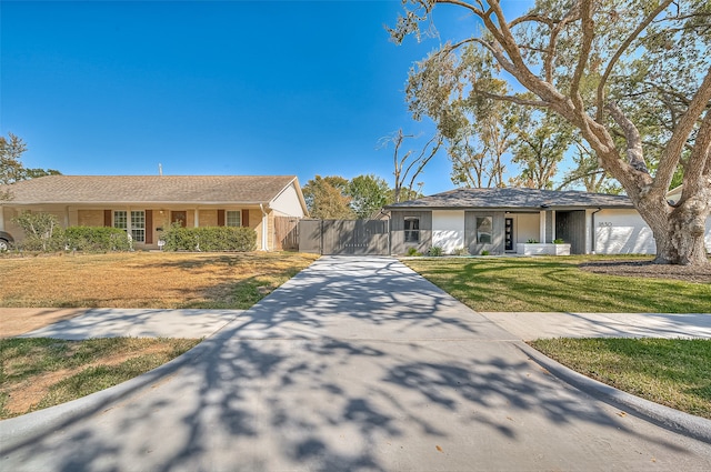 ranch-style home with a front yard and a garage