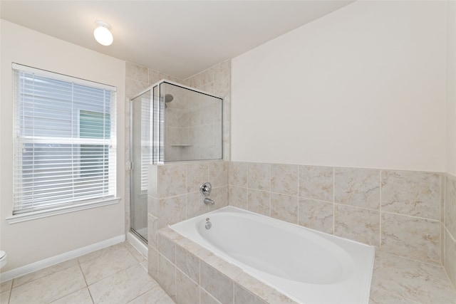 bathroom featuring tile patterned flooring, plus walk in shower, and toilet