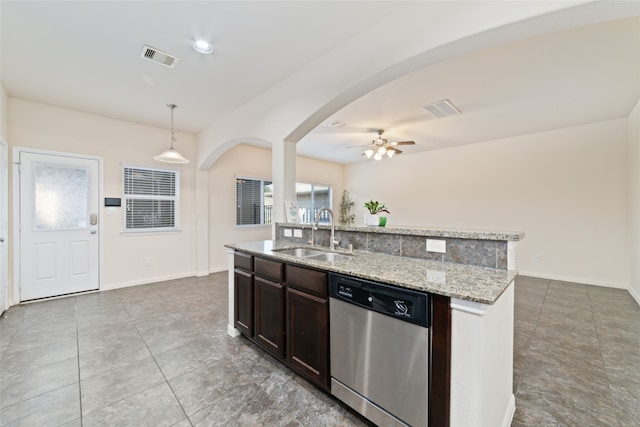 kitchen featuring dark brown cabinetry, sink, a center island with sink, decorative light fixtures, and dishwasher