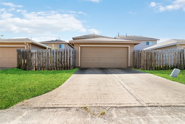 garage featuring a lawn