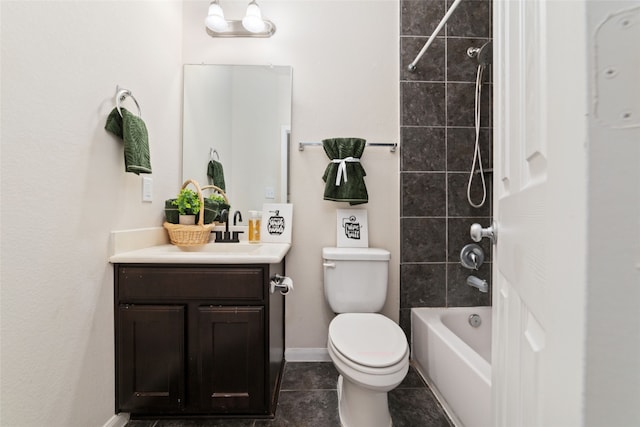 full bathroom featuring tile patterned flooring, tiled shower / bath combo, vanity, and toilet