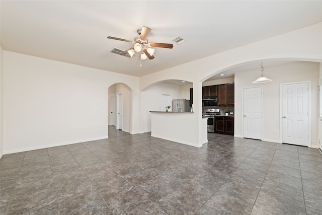 unfurnished living room with ceiling fan