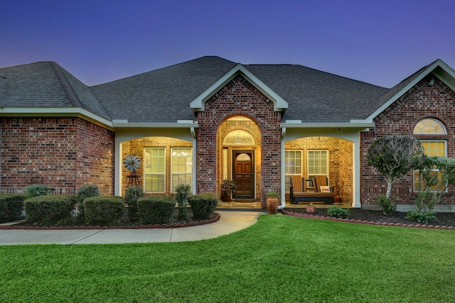 view of front of home with a lawn