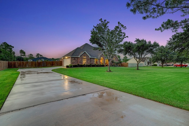 ranch-style house featuring a lawn