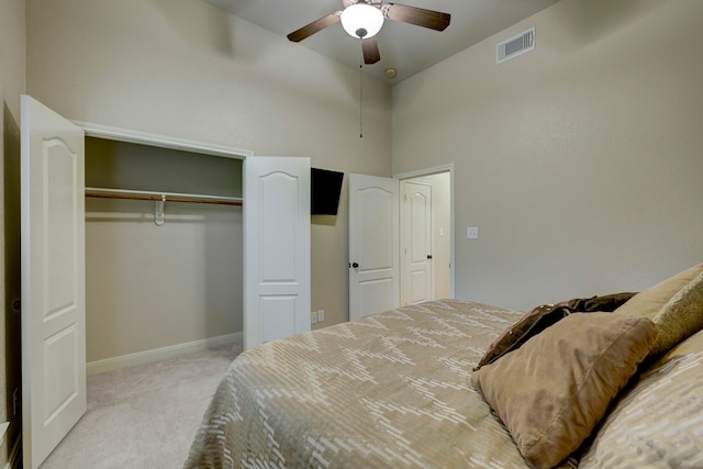 carpeted bedroom with a closet and ceiling fan