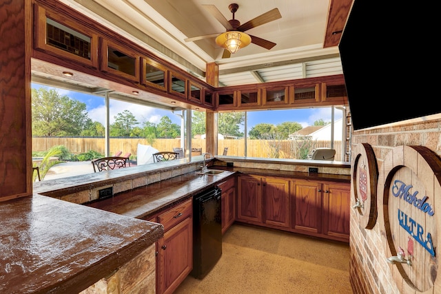 view of patio / terrace with ceiling fan, an outdoor kitchen, and sink