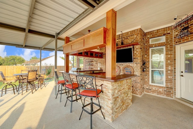 view of patio featuring exterior bar