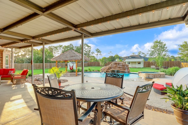 view of patio with a gazebo, a swimming pool with hot tub, pool water feature, and a storage shed