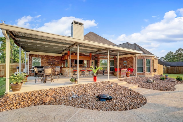 rear view of house featuring a patio