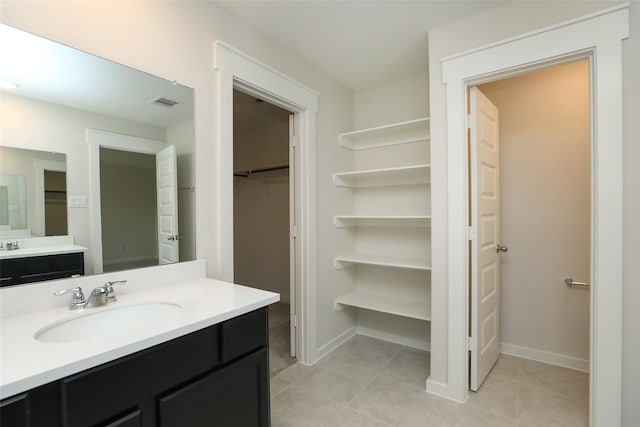 bathroom featuring vanity and tile patterned flooring