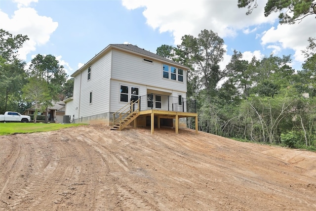 back of house featuring cooling unit