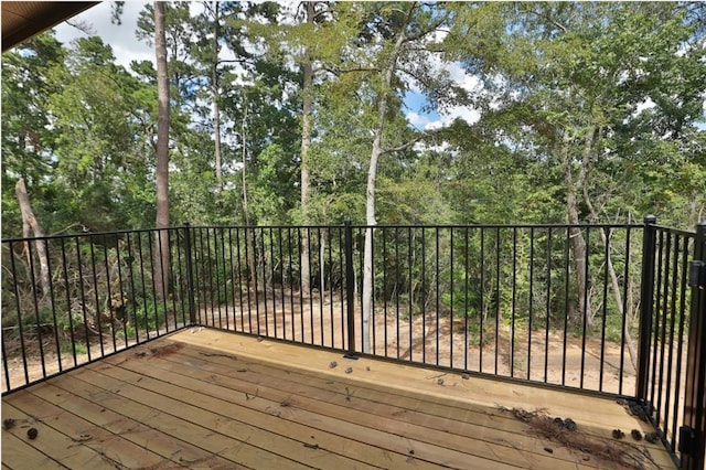 12135 Mustang Ave, Willis, TX 77378 - deck with view of wooded area