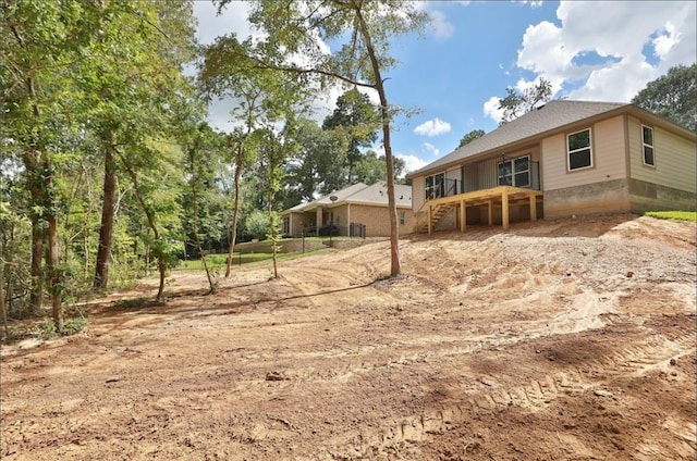 12135 Mustang Ave, Willis, TX 77378 - back of property featuring stairway