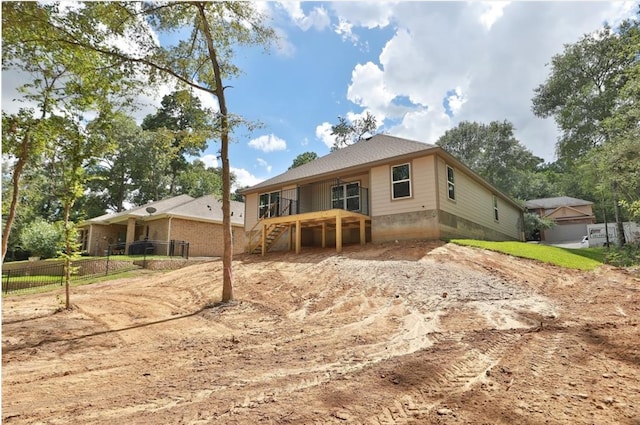 12135 Mustang Ave, Willis, TX 77378 - back of house featuring stairs