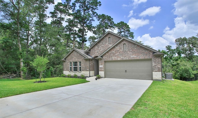 12135 Mustang Ave, Willis, TX 77378 - view of front of house with brick siding, an attached garage, concrete driveway, and a front lawn