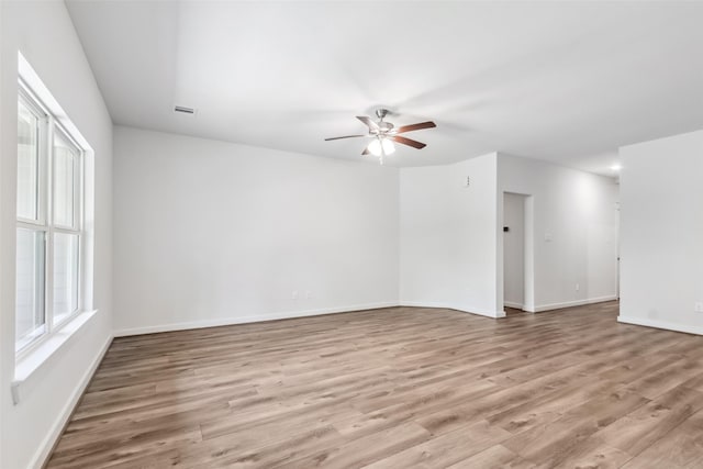 12135 Mustang Ave, Willis, TX 77378 - spare room with ceiling fan and light wood-style flooring