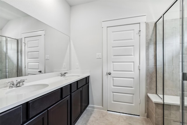12135 Mustang Ave, Willis, TX 77378 - full bath with tile patterned floors, double vanity, and a stall shower