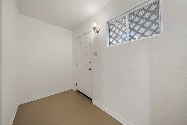 entryway featuring a textured ceiling