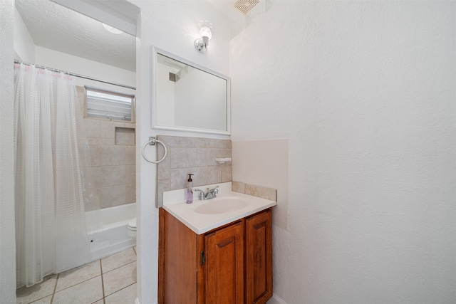 full bathroom with vanity, tile patterned floors, shower / bath combo, toilet, and a textured ceiling