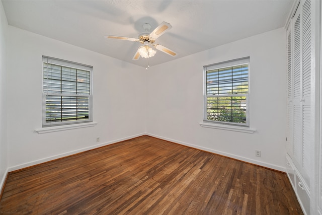 unfurnished bedroom featuring ceiling fan, a closet, and dark hardwood / wood-style floors