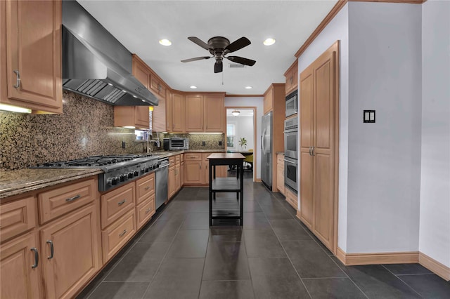 kitchen with appliances with stainless steel finishes, wall chimney exhaust hood, ornamental molding, and light stone countertops