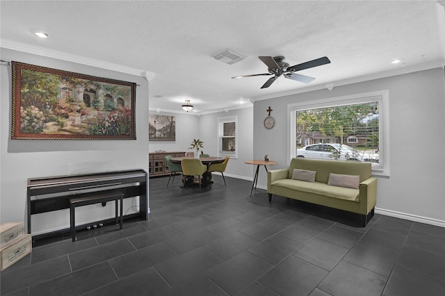 sitting room with crown molding, ceiling fan, and a textured ceiling