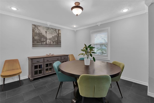 tiled dining space featuring ornamental molding