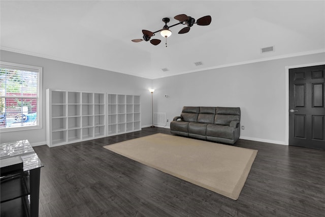 living room featuring ceiling fan, ornamental molding, and dark hardwood / wood-style flooring