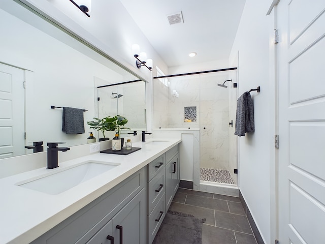 bathroom featuring vanity, tile patterned flooring, and an enclosed shower